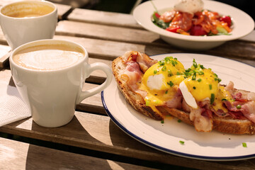 Eggs benedict and coffee for breakfast
