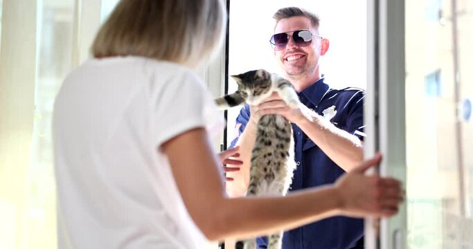 Policeman giving missing kitten to woman at home 4k movie slow motion 