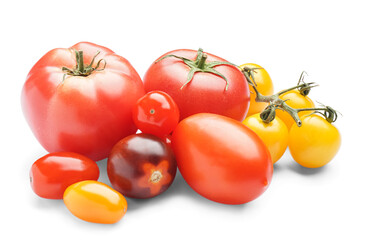 Heap of fresh different tomatoes on white background