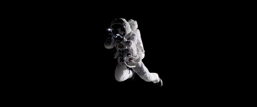 Caucasian female astronaut using her mobile phone during spacewalk, messaging, taking pictures