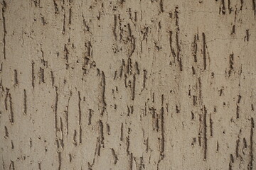 Close shot of beige wall with stucco worm finish