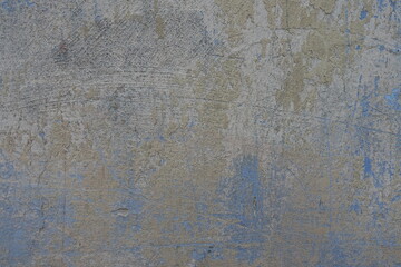 Beige and blue old, faded and scratched painted wall texture