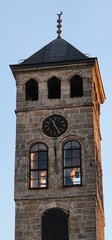 Low angle shot of a tower with wall clock