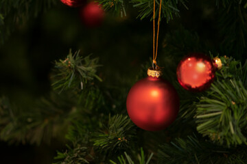 Christmas ball on tree. Closeup on Christmas tree decoration over festive background