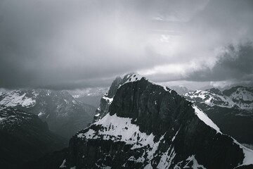 Breathtaking grayscale of snowy rocky mountains