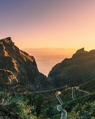 Vertical shot of scenic mountains with a sunset sky in Masca Canyon, Tenerife, Canary Islands © Nerijus3/Wirestock Creators