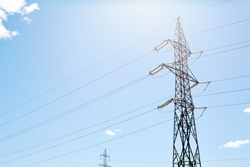 Electric pole with wires under the blue sky