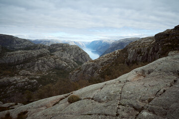 Fototapeta na wymiar Lysefjord aerial panoramic view from the Preikestolen cliff near Stavanger. Preikestolen or Pulpit Rock is a famous tourist attraction in Norway.