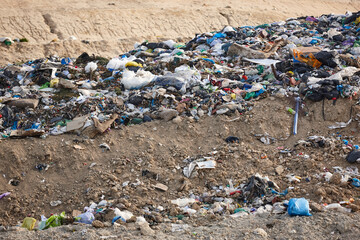Open air garbage dump. Plastic waste pollution. Global warming. Consumerism