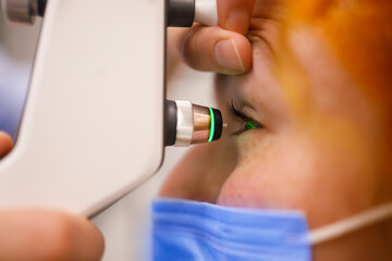 A female patient has a professional eye exam