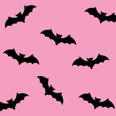 Naklejka premium halloween pattern with bats on a pink background