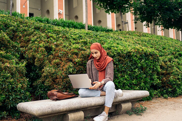Young Muslim Woman Using Computer