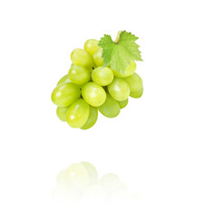 Green grape with leaves flying in the air isolated on white background.