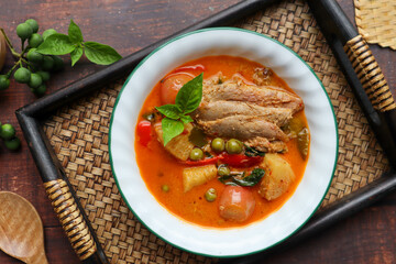 Roast duck red curry - Thai food called Kang Pled Ped Yang at top view on bamboo tray, Flat lay food