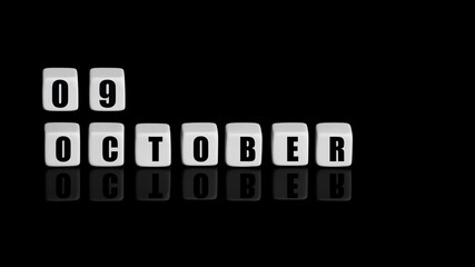October 9th. Day 9 of month, Calendar date. White cubes with text on black background with...