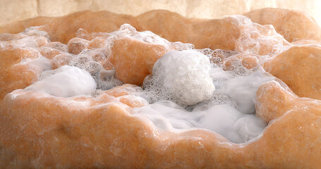 Macro abstract photo of real soap suds bubbles texture.