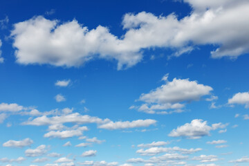 Naklejka na ściany i meble Blue sky natural background. White clouds in the blue sky