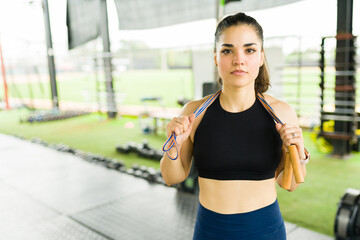 Fitness woman using a jumping rope at the gym