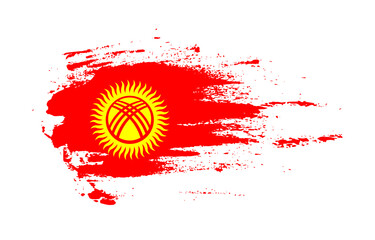 Grunge brush stroke flag of Kyrgyzstan with painted brush splatter effect on solid background