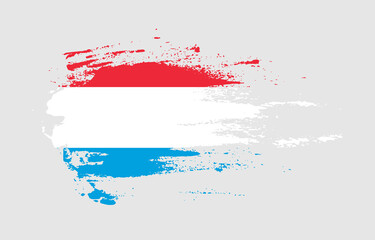 Grunge brush stroke flag of Luxembourg with painted brush splatter effect on solid background