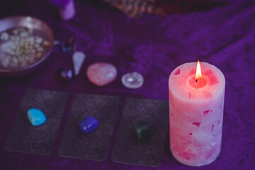 Candle burns on the altar, candles magic, clean aura and negative energy, wicca concept