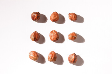 Hazelnuts isolated on white background. Composition of nuts pattern. Top view. Flatlay