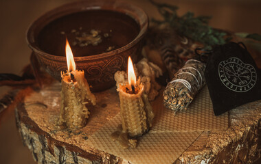 Candle burns on the altar, candles magic, clean aura and negative energy, wicca concept