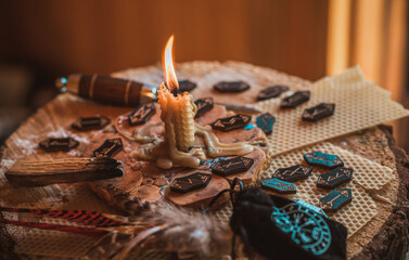 Candle burns on the altar, candles magic, clean aura and negative energy, wicca concept