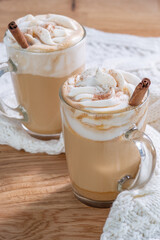 Pumpkin latte in a glasses. Autumn drink for Halloween or Thanksgiving.