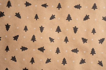Wrapping paper for gifts with a winter print. Brown recycled paper texture background. Textured...