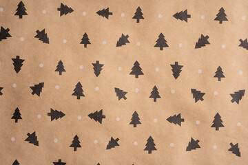 Wrapping paper for gifts with a winter print. Brown recycled paper texture background. Textured paper background. Kraft paper texture. 
