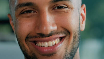 Close up head shot male portrait cheerful glad carefree smiling African Latina guy man client businessman healthy bearded boss entrepreneur model with white toothy oral dental smile looking at camera