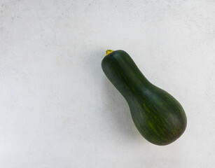 Raw zucchini on a light gray table. Top view, copy space