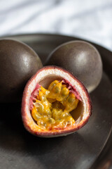 fresh passionfruit on table. cutted maracuya
