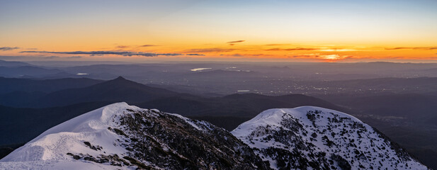 panoramic sunset over white mountains