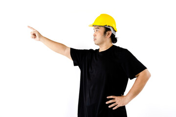 Asian man wear yellow safety helmet and black t-shirt is pointing the finger to order something isolated on white background.