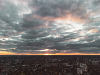 Aerial evening dramatic sunset Kharkiv city Pavlove Pole district. Multistory residential buildings in autumn