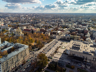 Sunny aerial autumn view of tourist attractions in Kharkiv city center. Ballet theater, Mirror Stream, church and scenic sky. City sights rooftop, Ukraine