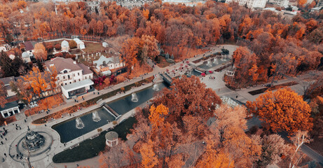 Obraz premium Aerial panoramic view on autumn Shevchenko City Garden with fountains. Tourist attraction in park, rooftop in Kharkiv, Ukraine