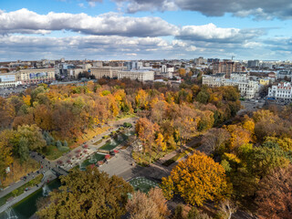 Aerial view on vibrant autumn Shevchenko city park with fountains. Tourist attraction in Kharkiv, Ukraine