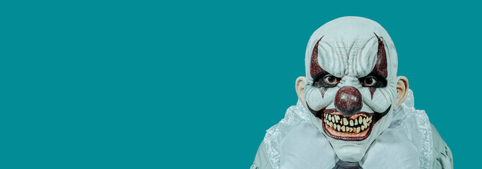 evil clown with a creepy smile, web banner
