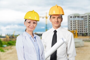 Professional engineer workers posing on the construction site