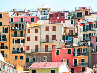 Fototapeta na wymiar ancient multicolored Ligurian buildings of the village of manarola, architectural background
