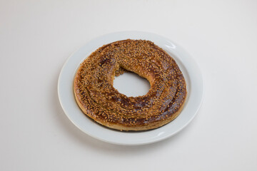 Sesame Tahini Bun Tahini Donut on a round white plate