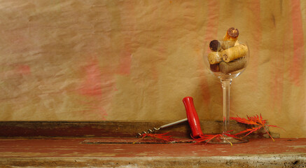Wine and champagne corks, corkscrew and red leafs on a grungy background. Wine and autumn concept,...
