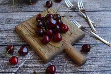 Ripe cherries on a board close-up. Summer, harvest, season