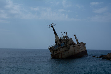 Old shipwreck and blue water