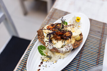 gourmet meat milanese with decoration on a white dish
