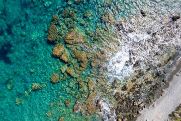 The sea view, the rocks on the beach with turquoise sea water.