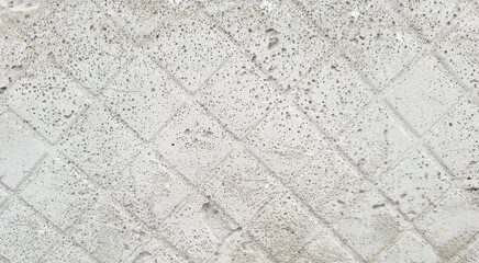 Concrete wall with traces of tiles